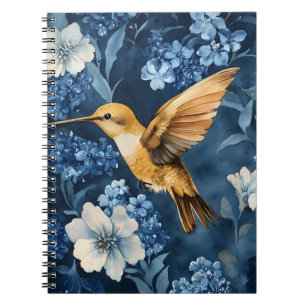 goldener Kolibri, der zwischen Blau und Weiß flieg Notizblock