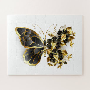 Goldener Schmetterling mit schwarzem Orchid