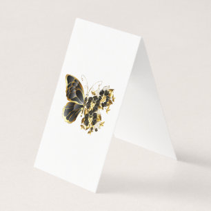 Goldener Schmetterling mit schwarzem Orchid