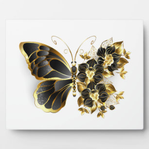 Goldener Schmetterling mit schwarzem Orchid Fotoplatte