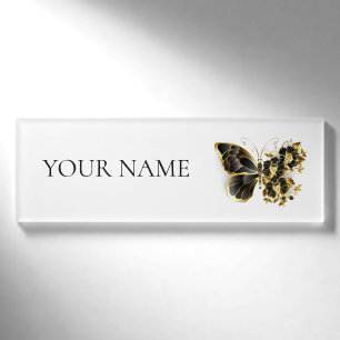 Goldener Schmetterling mit schwarzem Orchid Namenschild