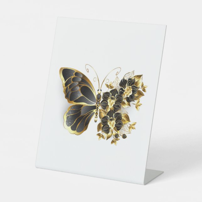 Goldener Schmetterling mit schwarzem Orchid Sockelschild (Vorderseite)
