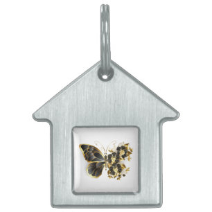 Goldener Schmetterling mit schwarzem Orchid Tiermarke
