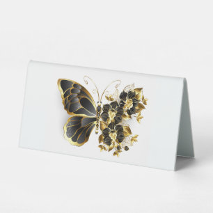 Goldener Schmetterling mit schwarzem Orchid Tischaufsteller