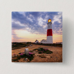 Goldener Sonnenaufgang an Leuchtturm Portlands Button