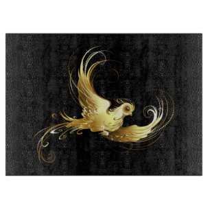 Goldener Vogel auf schwarzem Hintergrund Schneidebrett