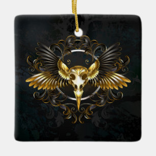 Goldener Vogelschädel auf schwarzem Hintergrund Keramikornament