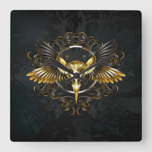 Goldener Vogelschädel auf schwarzem Hintergrund Quadratische Wanduhr
