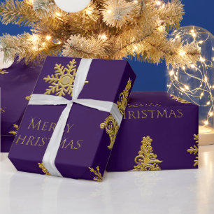Goldener Weihnachtsbaum-Schneeflocke auf lila Verp Geschenkpapier