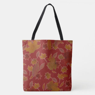 Goldenes Herbst-Blätter auf roter Tasche