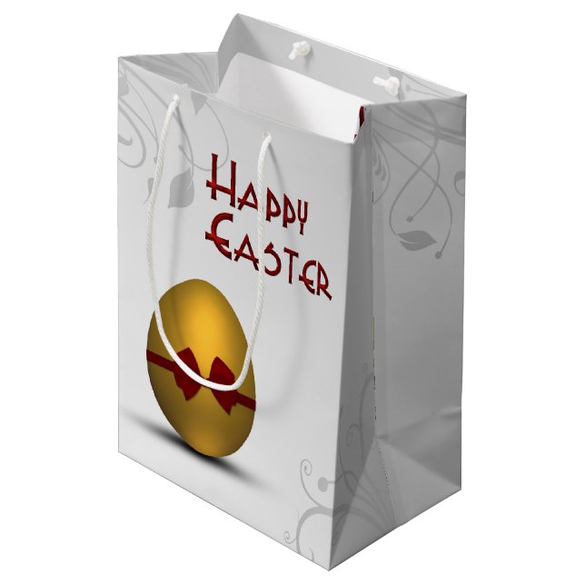 Goldenes Ostereier mit braunem, floralfarbenem Mus Mittlere Geschenktüte (Vorderseite Schrägansicht)