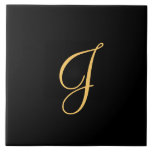 Goldfarbener Erstling J auf schwarzem Hintergrund Fliese<br><div class="desc">Goldfarbener Erstling J auf schwarzem Hintergrund</div>