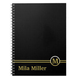 Goldmonogramm auf schwarzem Hintergrund Notizblock