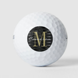 Goldmonogramm Initiale und Name auf schwarzem Gesc Golfball