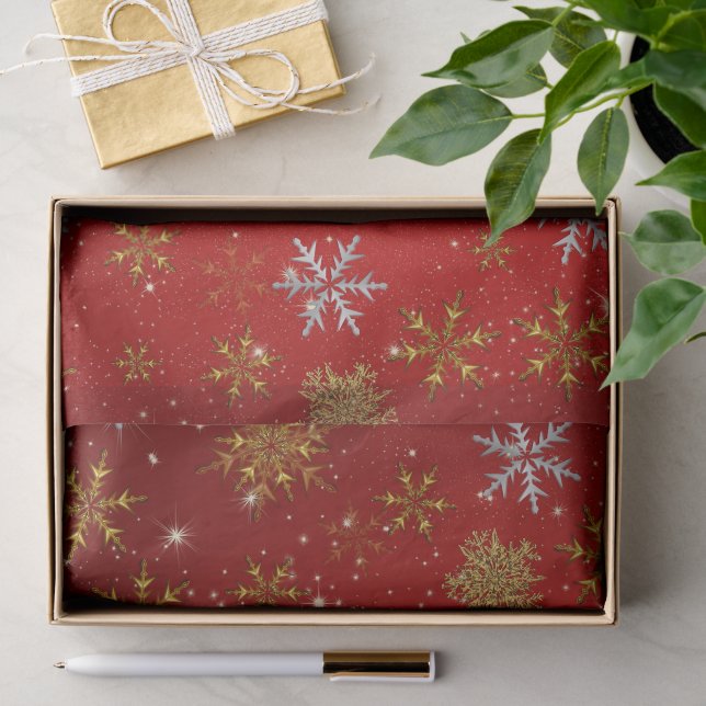Goldschneeflocken auf Weihnachts Rot Seidenpapier (Geschenk)
