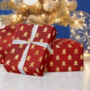 Goldweihnachtskuchen Männer auf Rot Geschenkpapier
