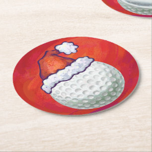 Golf-Ball in der Weihnachtsmannmütze auf Rot Runder Pappuntersetzer