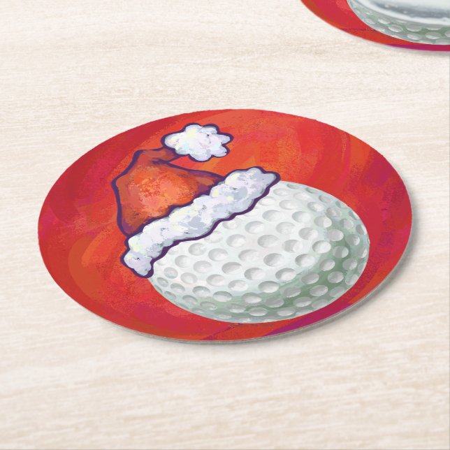 Golf-Ball in der Weihnachtsmannmütze auf Rot Runder Pappuntersetzer (Angewinkelt)