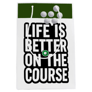 Golf-Ruhestand mit Golfball auf Grün Mittlere Geschenktüte