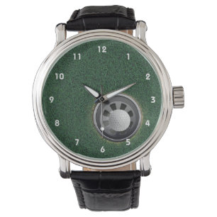 Golf-Schale und Ball auf den Grüntönen Armbanduhr