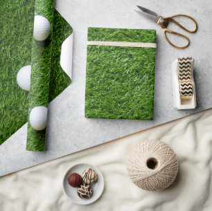 Golfball auf grünem Gras Geschenkpapier