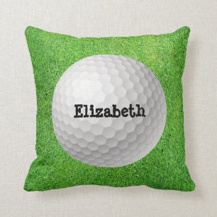 Golfball auf grünem Kissen