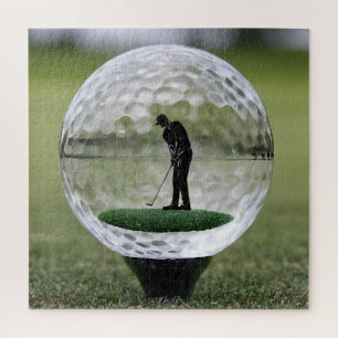 Golfball aus Glas mit Golfspieler darin,