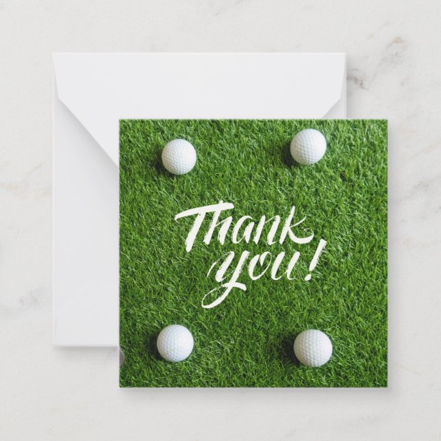 Golfball mit Dankeschön Wort auf grünem Gras Mitteilungskarte (Vorderseite)