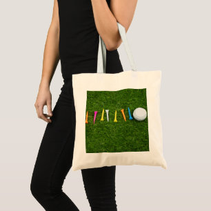 Golfball mit T-Shirts auf grünem Rasen Tragetasche