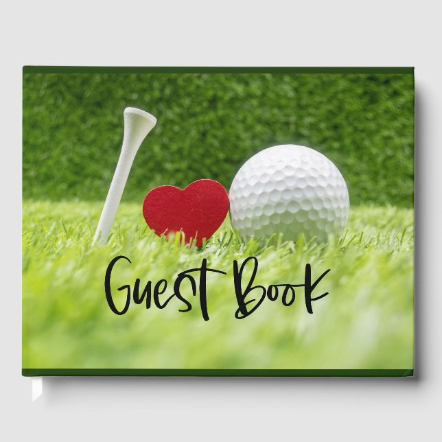 Golfball und Abschlag auf grünem Gras mit Liebe Gästebuch (Vorderseite)