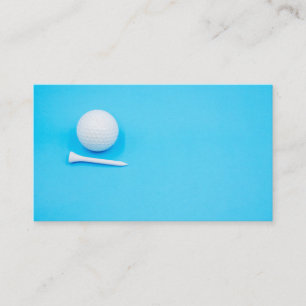 Golfball und Tee auf blauem Grund Visitenkarte
