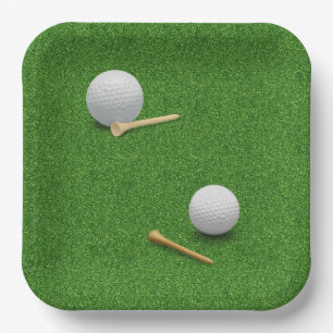 Golfball und Tee auf grünem Gras Hintergrund Pappteller