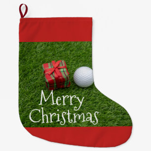 Golfball und Weihnachten Auf grünem Gras präsent Großer Weihnachtsstrumpf