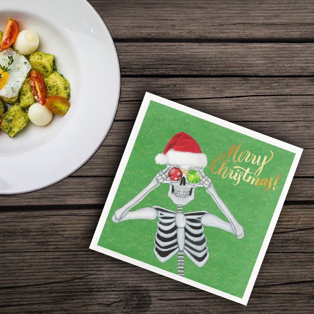Goofy Christmas Skeleton Ornament Eyes Hat Green Serviette (Fun skeleton holding ornaments to eyes on green Merry Christmas paper party napkins)