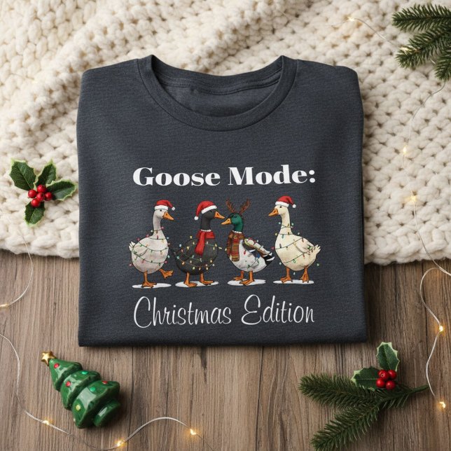 Goose Mode Christmas Edition T-Shirt Tri-Blend Shirt (folded dark gray Christmas shirt with goose design on cozy knit blanket and festive decor)