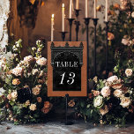 Gothic Black Raven & Black Arch Rust Wedding Tischnummer<br><div class="desc">Mit unserer Vintag gotischen Hochzeitskarte bringen Sie Ihre Gäste in eine Welt der dunklen, bezaubernden Eleganz. Der tiefe, gelbe, orangefarbene Rosthintergrund Set die Bühne für einen auffallenden Kontrast, da fett weißer Text aus feinen, schwarzen Textfeldern entsteht. Am Höhepunkt dieser Einladung nimmt ein dreidimensionaler gotischer Rahmen mit einem königlich schwarzen gotischen...</div>