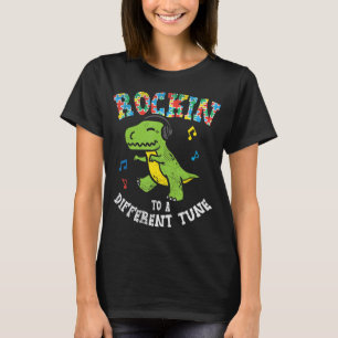 Grab this cute Rockin To Different Tune T-Rex Danc T-Shirt