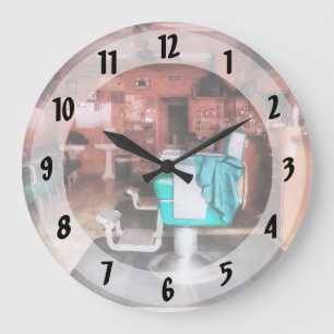 Grande Horloge Ronde Barber shop with Green Barber Chairs