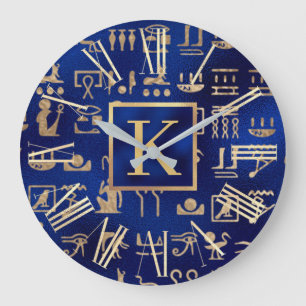 Grande Horloge Ronde Hiéroglyphes Égyptiens Dorés sur Initiale Bleue
