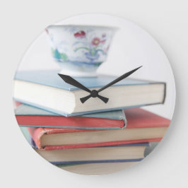 Grande Horloge Ronde Tea on book stack clock