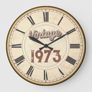 GRANDE HORLOGE RONDE TENDANCE NÉ EN 1973 CHIFFRES ROMAINS 