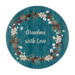 Grandma Christmas wreath on a rich teal Schneidebrett