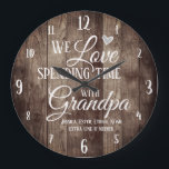 Grandpa Spending Time with Custom Name Große Wanduhr<br><div class="desc">Fun family clock with wood plank textured background. We Love spending time with grandpa custom grand kids names. Add the grand kids names at the bottom of the clock for a unique keepsake gift.</div>
