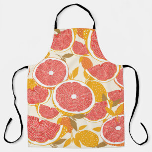 Grapefruit und halbierte Scheiben mit Blätter auf  Schürze