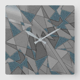 Graue Dreiecksausschnitte mit groben dunkelblauen  Quadratische Wanduhr