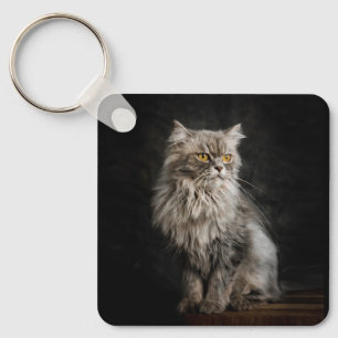 Graue flauschige Katze Schlüsselanhänger
