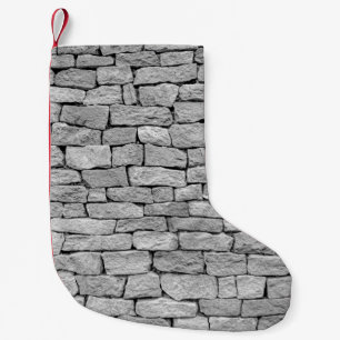 Graue Steinmauer, abstrakter Hintergrund. Kleiner Weihnachtsstrumpf