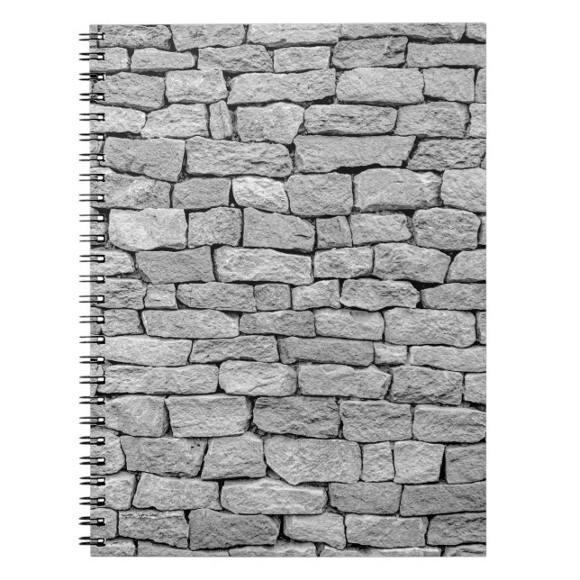 Graue Steinmauer, abstrakter Hintergrund. Notizblock (Vorderseite)