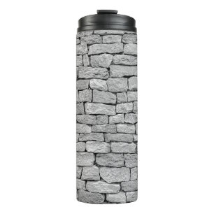 Graue Steinmauer, abstrakter Hintergrund. Thermosbecher