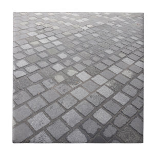 Grauer quadratischer pflasternhintergrund fliese